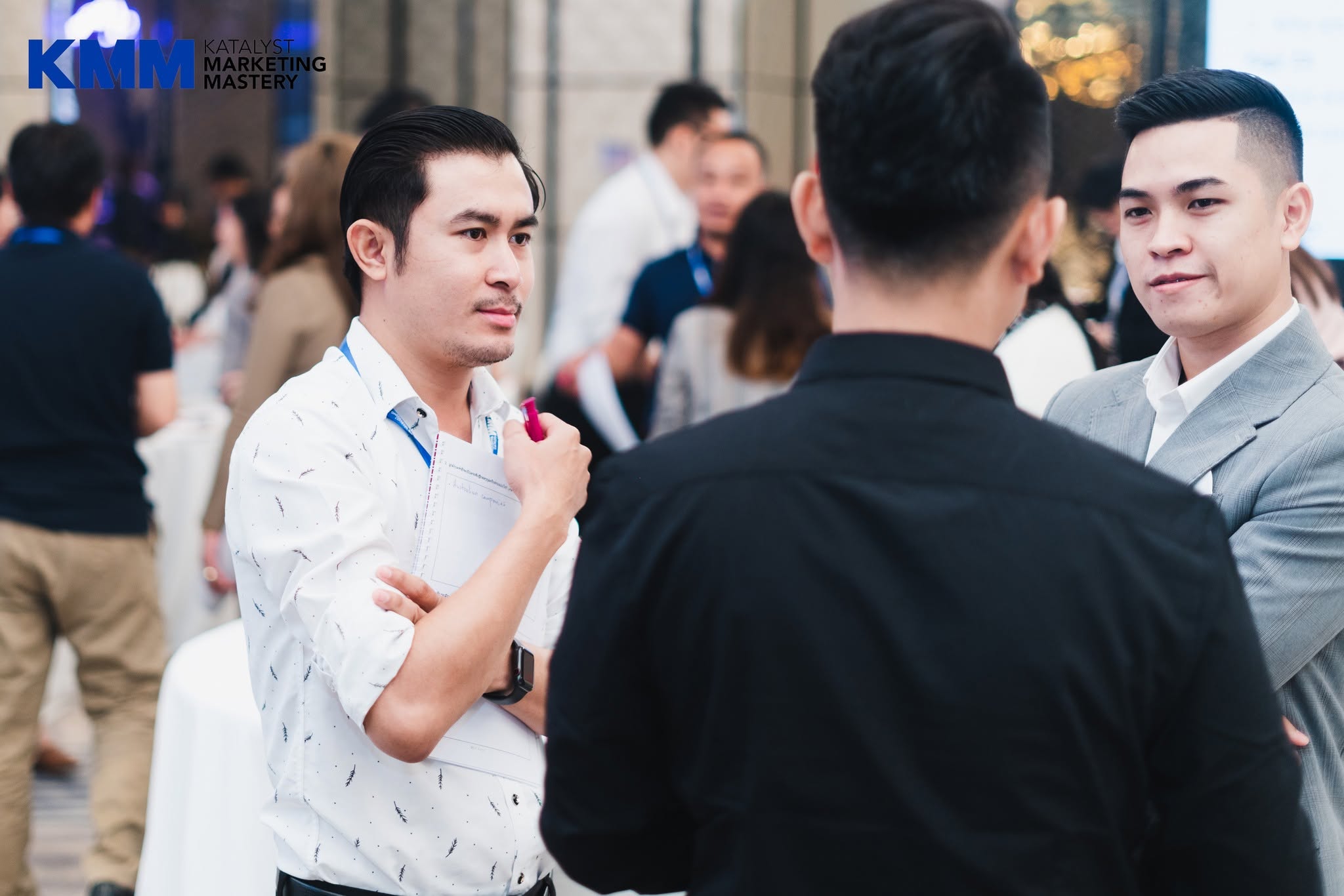 Lao businesspeople discussing ideas during a practical marketing activity