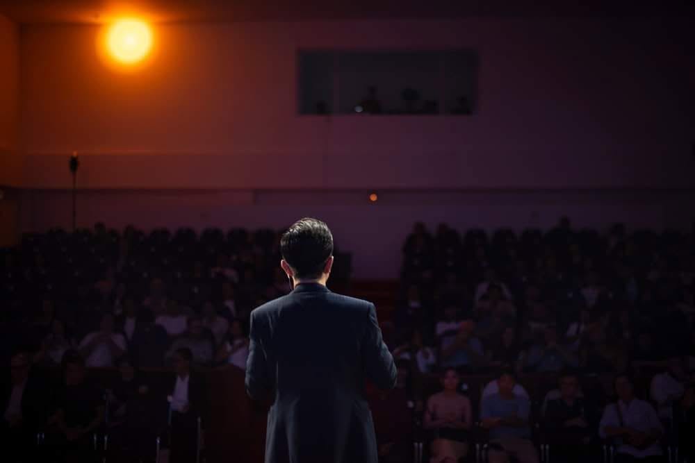 A Katalyst trainer addressing a large audience