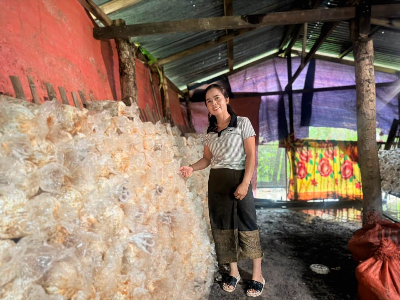 A young woman running a mushroom-growing enterprise