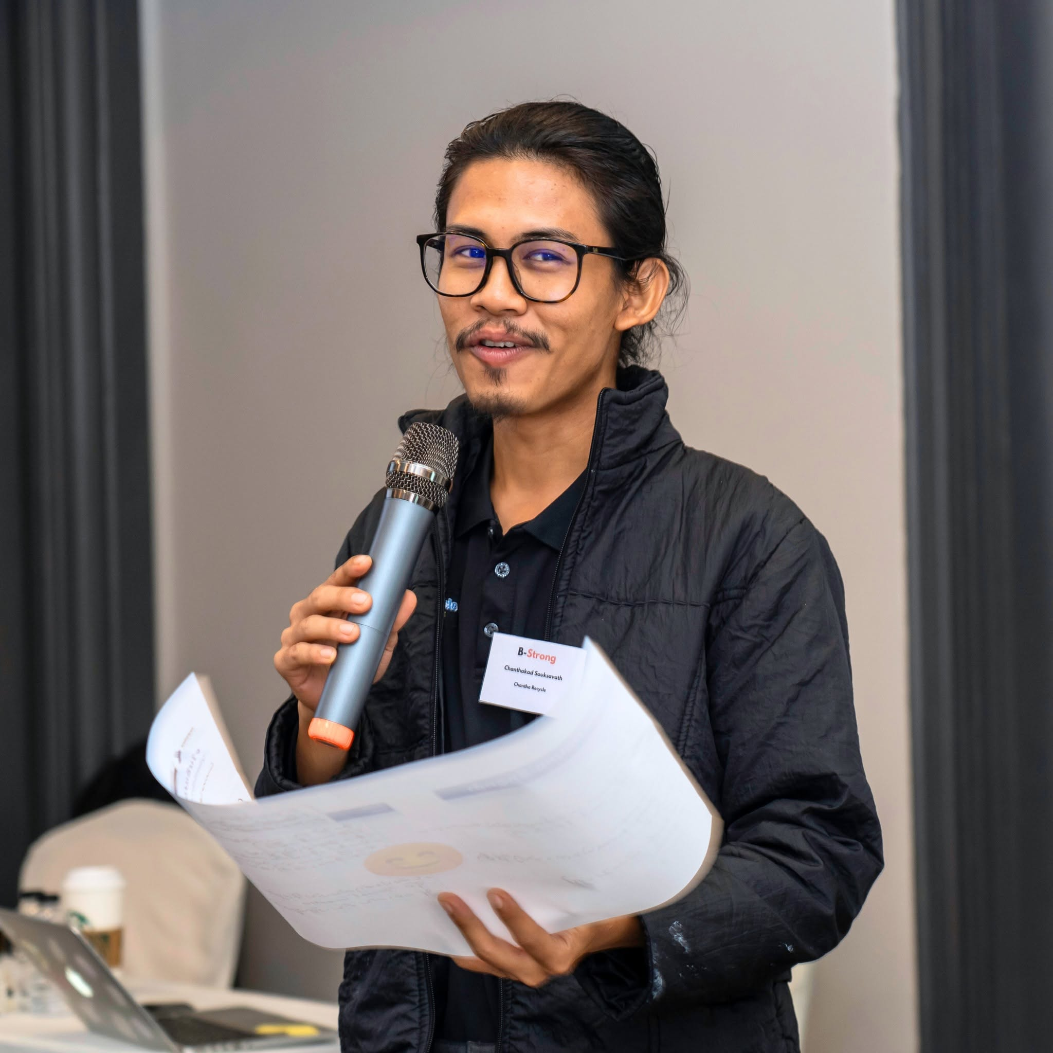 A B-Strong entrepreneur sharing his work during the program
