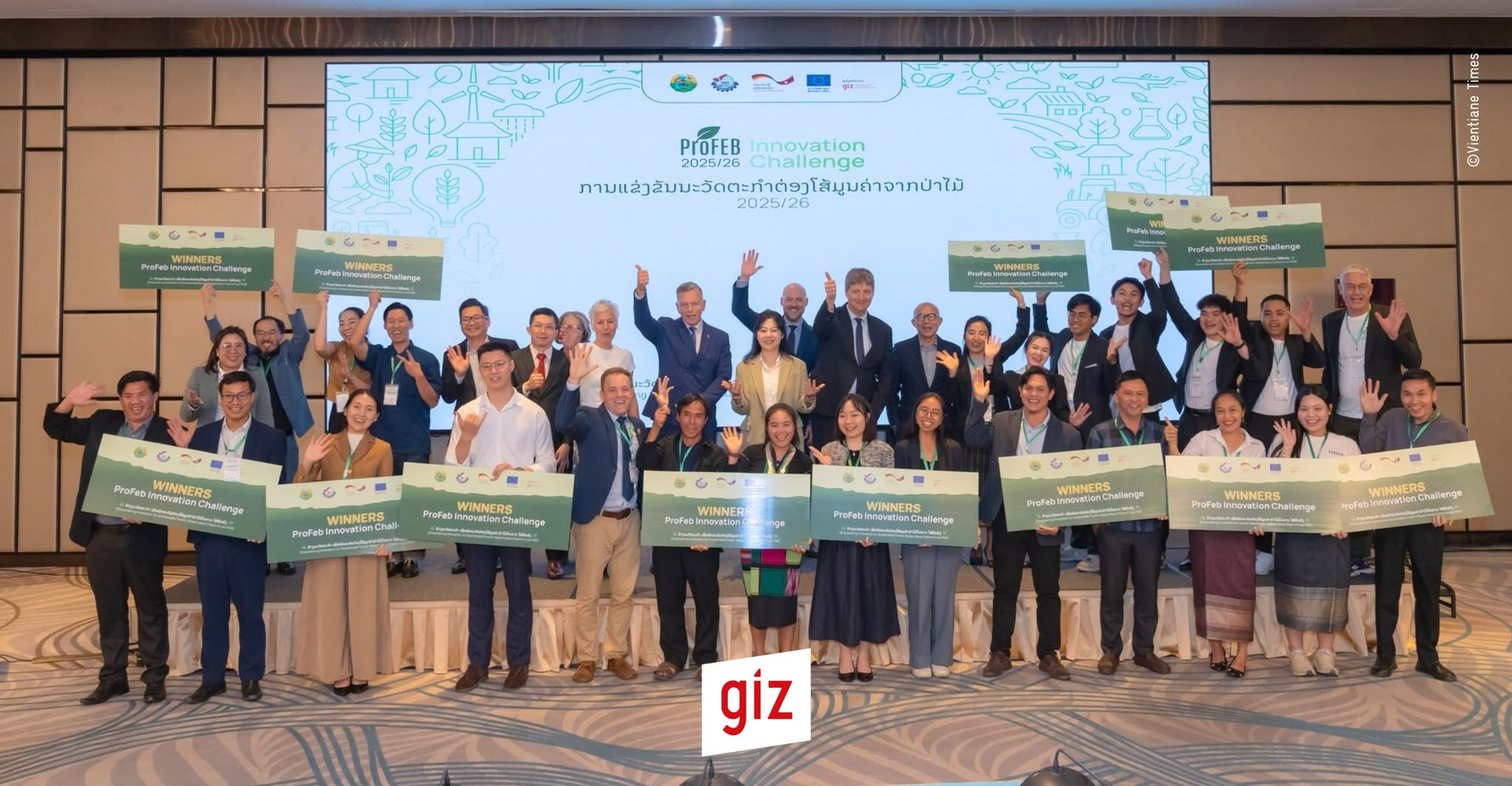 Entrepreneurs and partners celebrating at the ProFEB Innovation Challenge in Lao PDR