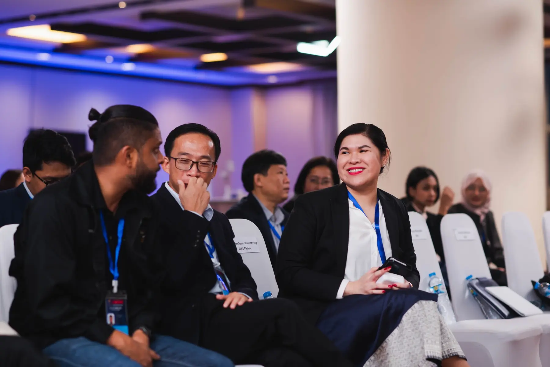 Regional event participants in conversation before the program begins