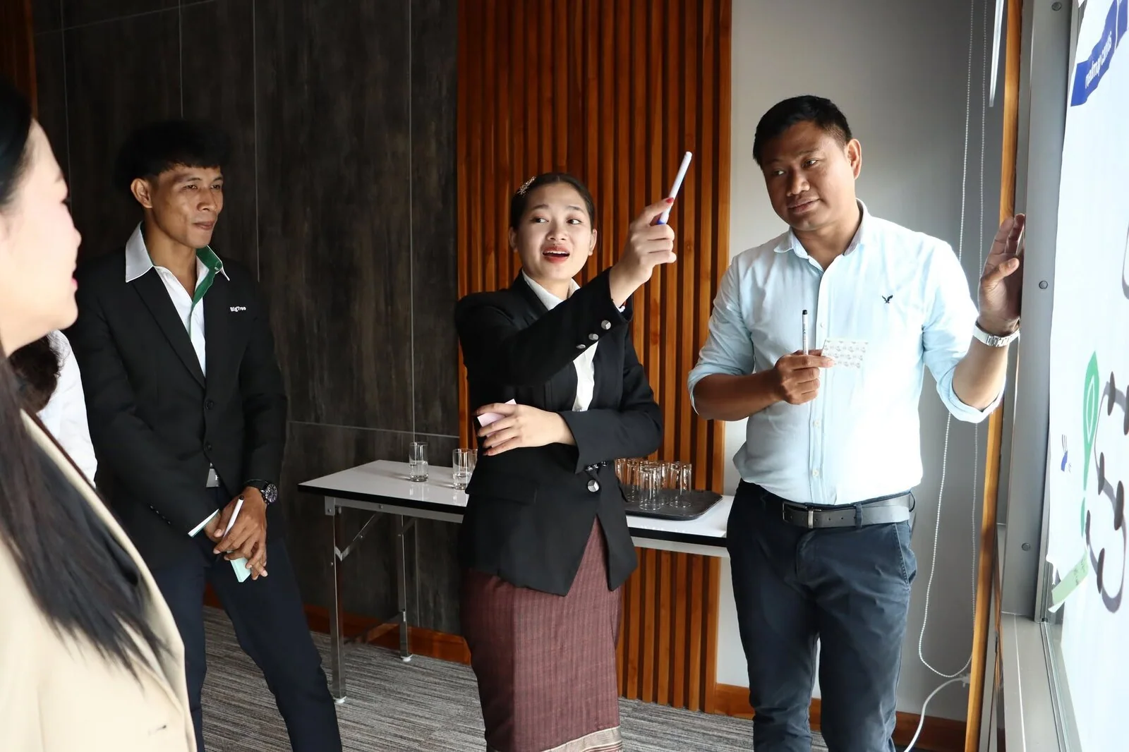 Minimart representatives presenting a plastic-reduction idea