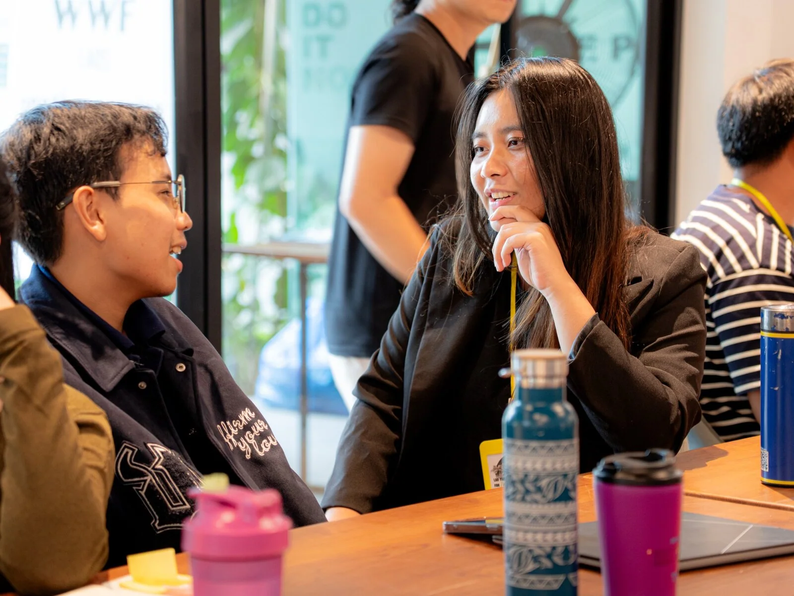Young conservation leaders exchanging ideas around a table