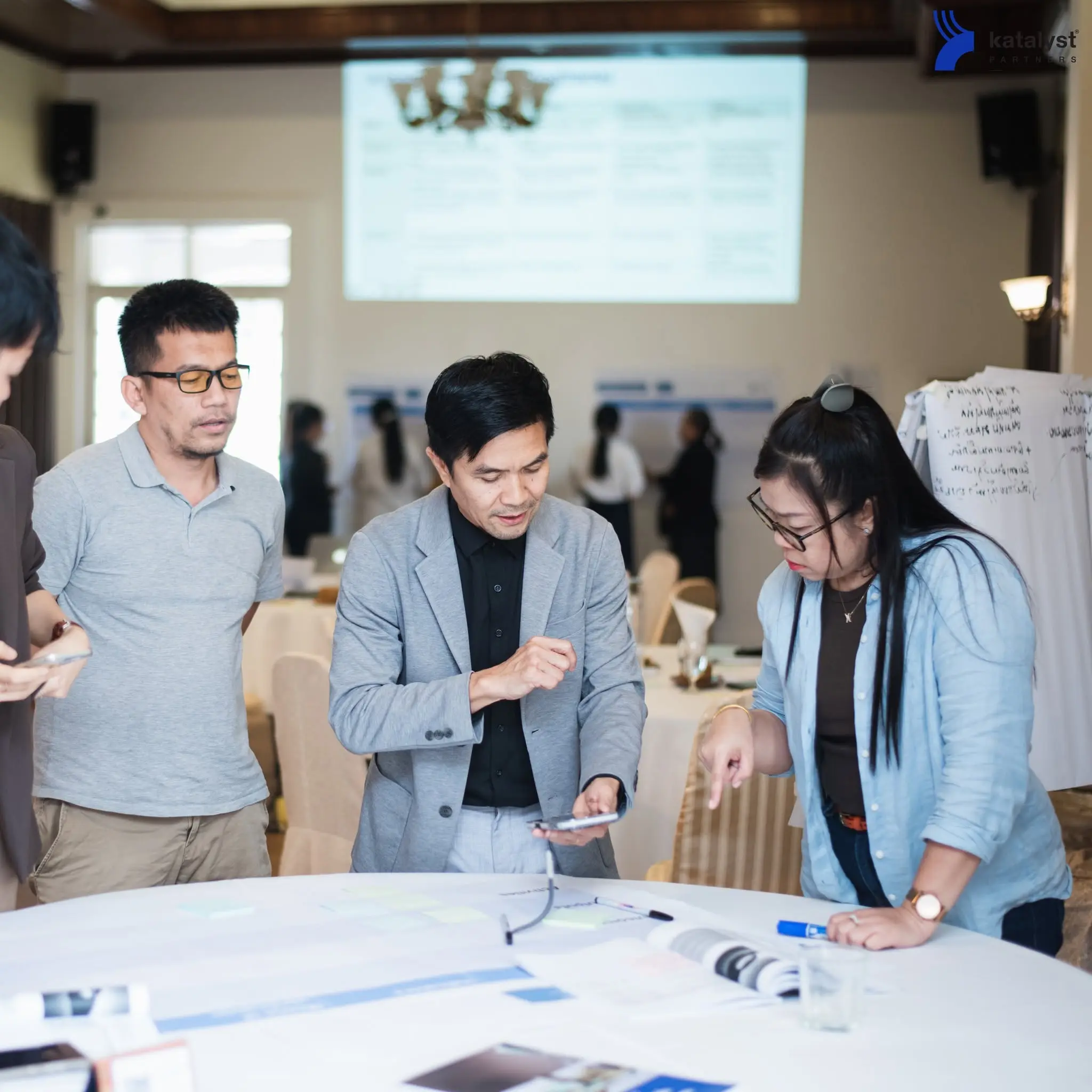 Participants working together during a Katalyst project management program