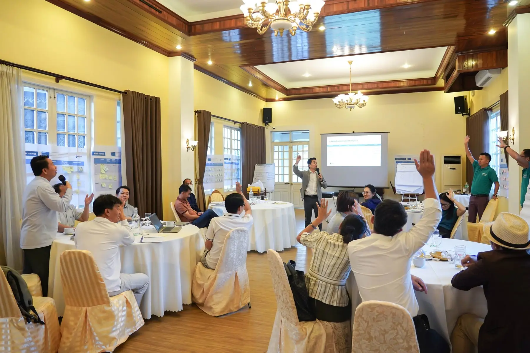 Project management participants and facilitators working together in a Katalyst program