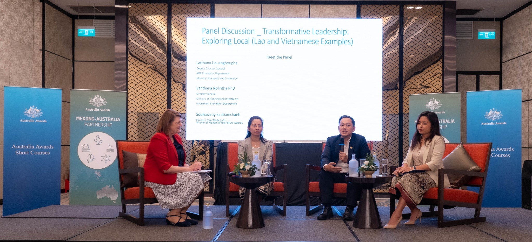 Lao and Vietnamese public-sector leaders presenting during the QUT program